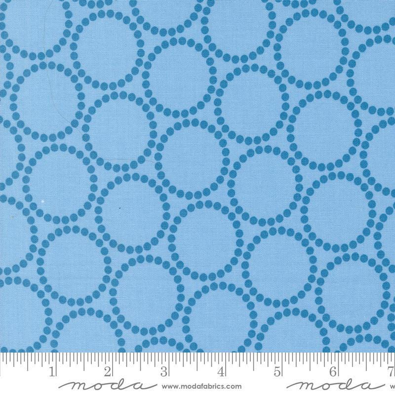Image of the Love Letter Dots Blue Skies quilting cotton fabric by Lizzy House for Moda Fabrics. Features dotted circles on a blue background. Cure Little Fabric Shop