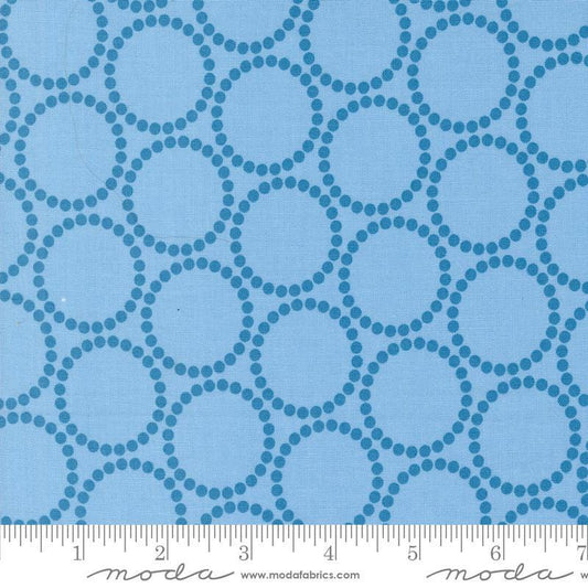 Image of the Love Letter Dots Blue Skies quilting cotton fabric by Lizzy House for Moda Fabrics. Features dotted circles on a blue background. Cure Little Fabric Shop