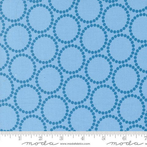 Image of the Love Letter Dots Blue Skies quilting cotton fabric by Lizzy House for Moda Fabrics. Features dotted circles on a blue background. Cure Little Fabric Shop