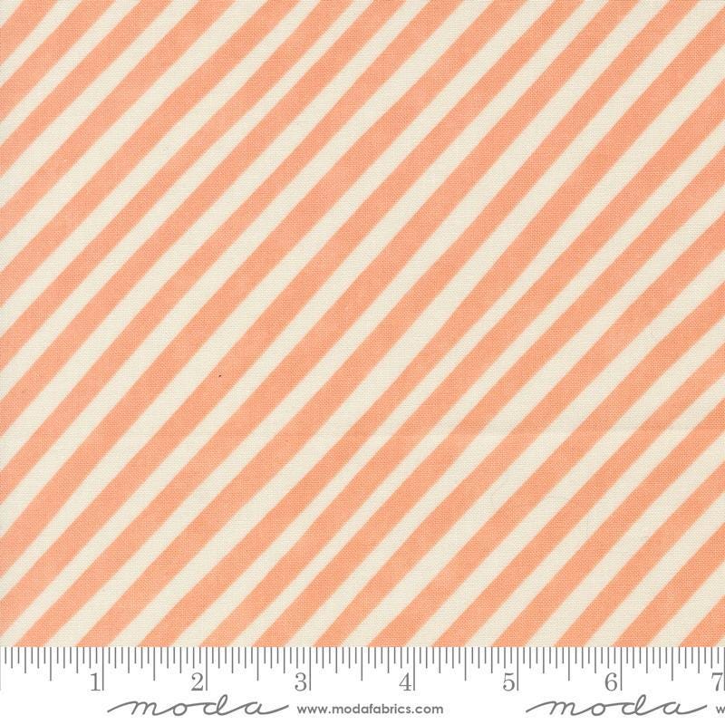 Image of the Love Letter Stripes Peach quilting cotton fabric by Lizzy House for Moda Fabrics. Features diagonal stripes on a coral background. Cure Little Fabric Shop