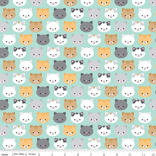 Image of the Pretty Kitty™ Kitties Blue quilting cotton fabric by Doodlebug Design Inc for Riley Blake Designs. Features kitty heads on a blue background. Cute Little Fabric Shop