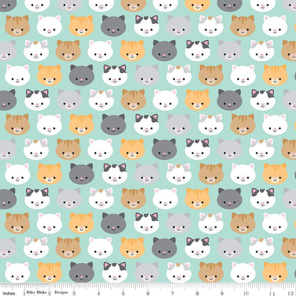 Image of the Pretty Kitty™ Kitties Blue quilting cotton fabric by Doodlebug Design Inc for Riley Blake Designs. Features kitty heads on a blue background. Cute Little Fabric Shop