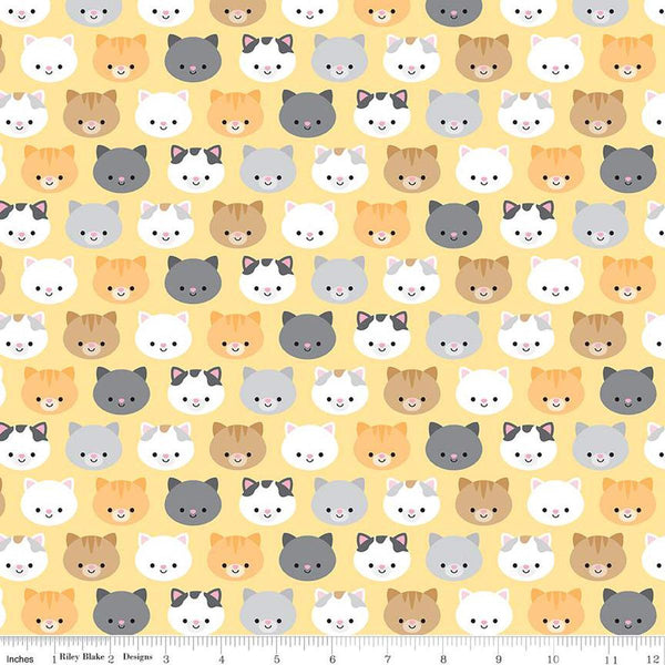 Image of the Pretty Kitty™ Kitties Yellow quilting cotton fabric by Doodlebug Design Inc for Riley Blake Designs. Features kitty heads on a yellow background. Cute Little Fabric Shop