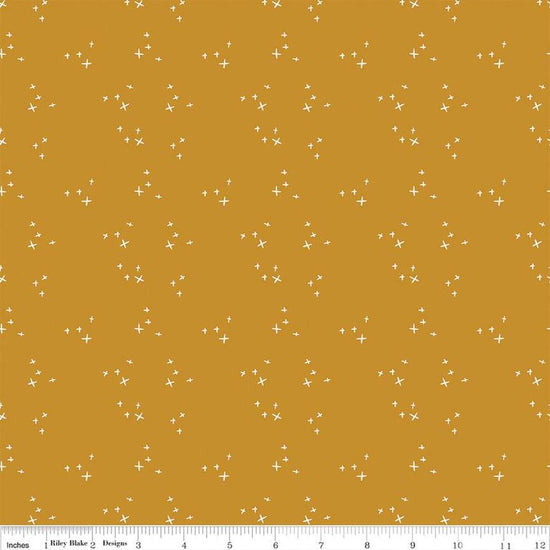 Blush 'n Butterscotch Cross Sparkles Butterscotch quilting cotton fabric by Simple Simon & Company for Riley Blake Designs. Features small sparkle crosses on a gold background. Cute Little Fabric Shop