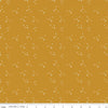 Blush 'n Butterscotch Cross Sparkles Butterscotch quilting cotton fabric by Simple Simon & Company for Riley Blake Designs. Features small sparkle crosses on a gold background. Cute Little Fabric Shop