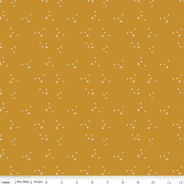 Blush 'n Butterscotch Cross Sparkles Butterscotch quilting cotton fabric by Simple Simon & Company for Riley Blake Designs. Features small sparkle crosses on a gold background. Cute Little Fabric Shop