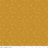 Blush 'n Butterscotch Cross Sparkles Butterscotch quilting cotton fabric by Simple Simon & Company for Riley Blake Designs. Features small sparkle crosses on a gold background. Cute Little Fabric Shop