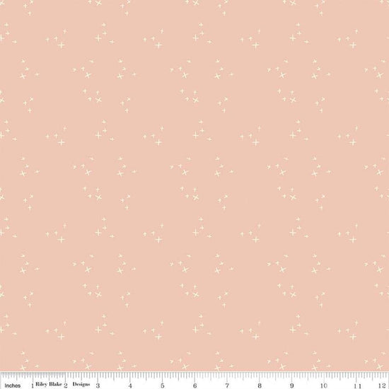 Blush 'n Butterscotch Cross Sparkles Blush quilting cotton fabric by Simple Simon & Company for Riley Blake Designs. Features small sparkle crosses on a pink background. Cute Little Fabric Shop