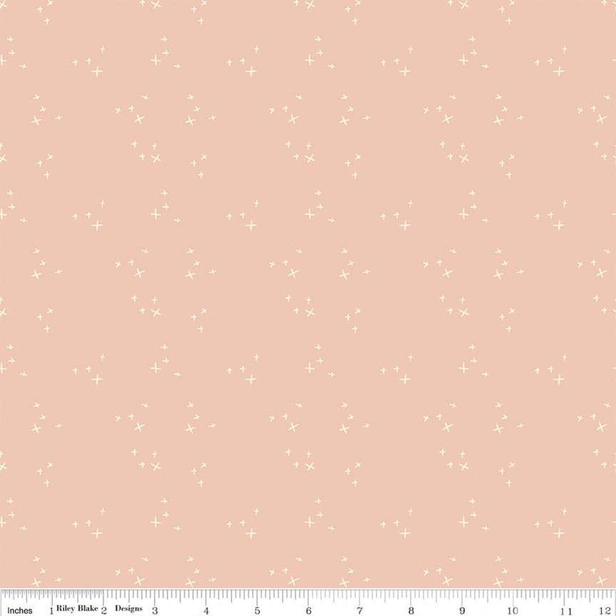 Blush 'n Butterscotch Cross Sparkles Blush quilting cotton fabric by Simple Simon & Company for Riley Blake Designs. Features small sparkle crosses on a pink background. Cute Little Fabric Shop