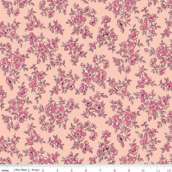 Image of the Precious Petites Blossoms Coral quilting cotton fabric by Gerri Robinson for Riley Blake Designs. Features small flowers on a pink background. Cute Little Fabric Shop