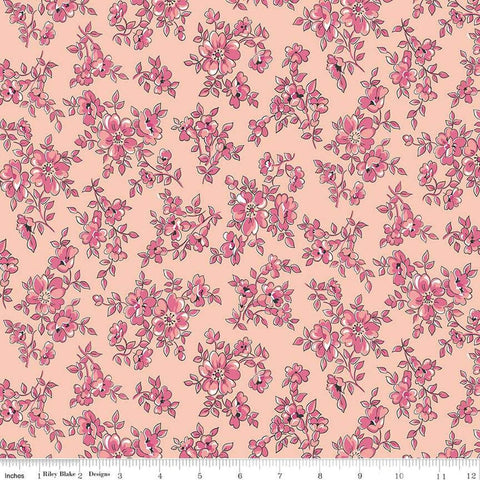 Image of the Precious Petites Blossoms Coral quilting cotton fabric by Gerri Robinson for Riley Blake Designs. Features small flowers on a pink background. Cute Little Fabric Shop