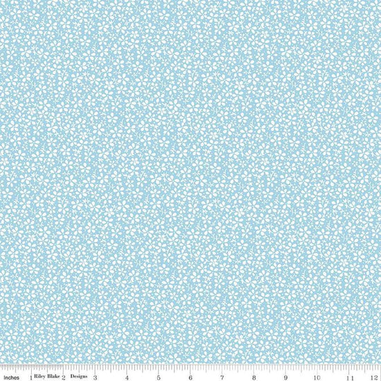 Image of the Precious Petites Daisies Sky quilting cotton fabric by Gerri Robinson for Riley Blake Designs. Features flowers on a blue background. Cute Little Fabric Shop