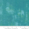 Image of the Sunday Brunch Grunge Basics Mint Tea quilting cotton fabric by Moda Fabrics. Features a textured pattern on a teal background. Cute Little Fabric Shop