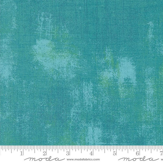 Image of the Sunday Brunch Grunge Basics Mint Tea quilting cotton fabric by Moda Fabrics. Features a textured pattern on a teal background. Cute Little Fabric Shop