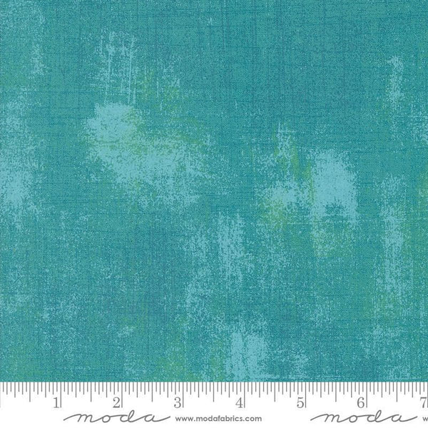 Image of the Sunday Brunch Grunge Basics Mint Tea quilting cotton fabric by Moda Fabrics. Features a textured pattern on a teal background. Cute Little Fabric Shop