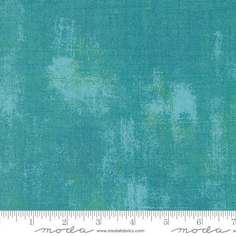 Image of the Sunday Brunch Grunge Basics Mint Tea quilting cotton fabric by Moda Fabrics. Features a textured pattern on a teal background. Cute Little Fabric Shop