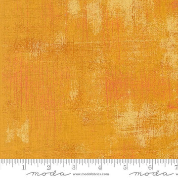 Image of the Sunday Brunch Grunge Basics OJ quilting cotton fabric by Moda Fabrics. Features a textured pattern on an orange background. Cute Little Fabric Shop