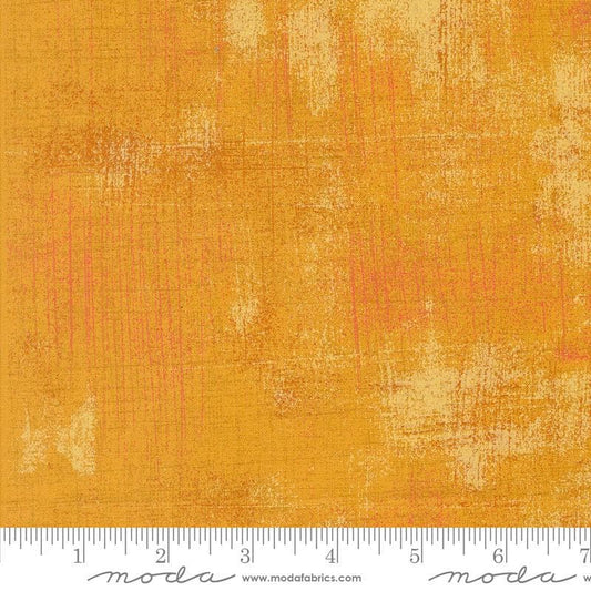 Image of the Sunday Brunch Grunge Basics OJ quilting cotton fabric by Moda Fabrics. Features a textured pattern on an orange background. Cute Little Fabric Shop