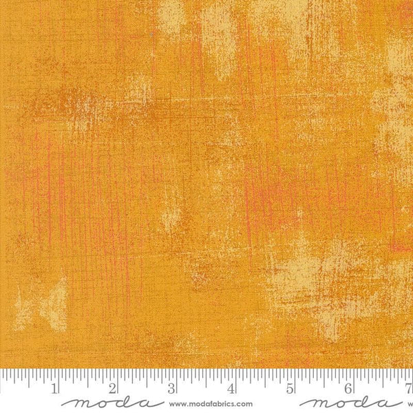 Image of the Sunday Brunch Grunge Basics OJ quilting cotton fabric by Moda Fabrics. Features a textured pattern on an orange background. Cute Little Fabric Shop