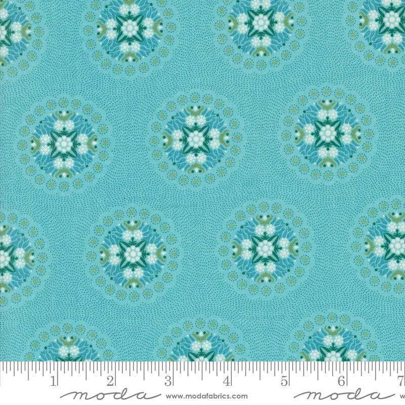 Image of the Sunday Brunch Geometrics Mint Tea quilting cotton fabric by Moda Fabrics. Features medallions on a teal background. Cute Little Fabric Shop