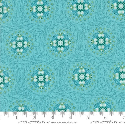 Image of the Sunday Brunch Geometrics Mint Tea quilting cotton fabric by Moda Fabrics. Features medallions on a teal background. Cute Little Fabric Shop