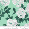 Image of the Love Letter Blossoms Seafoam quilting cotton fabric by Lizzy House for Moda Fabrics. Features large flowers on a teal background. Cure Little Fabric Shop