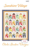 Image of the Sunshine Village quilt pattern Chelsi Stratton Designs for Moda Fabrics. Features houses on a quilt.
Cute Little Fabric Shop
