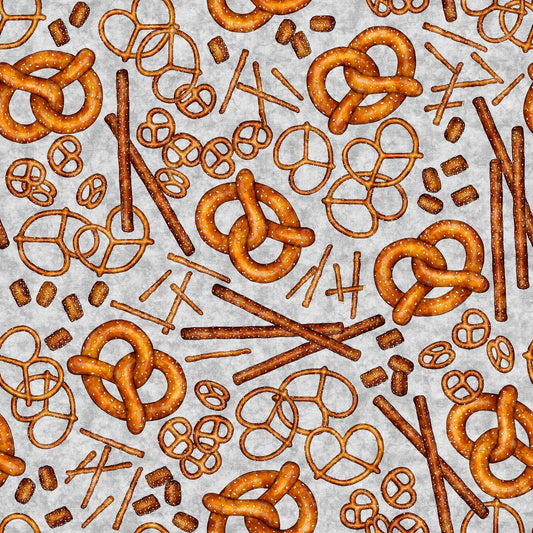Image of the Brewmaster Pretzels Gray quilting cotton by QT Fabrics. Features pretzels on a gray background. Cute Little Fabric Shop