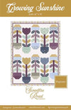 Image of the Growing Sunshine quilt pattern by Sweetfire Road for Moda Fabrics. Features a quilt with flowers on a white background.
Cute Little Fabric Shop
