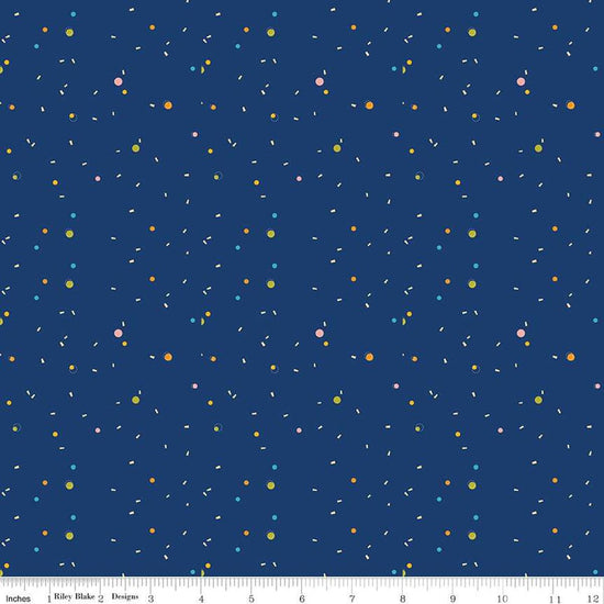 Image of the Pop 'n Play Confetti Navy quilting cotton fabric by Fisher-Price for Riley Blake Designs. Features spots on a blue background. Cute Little Fabric Shop