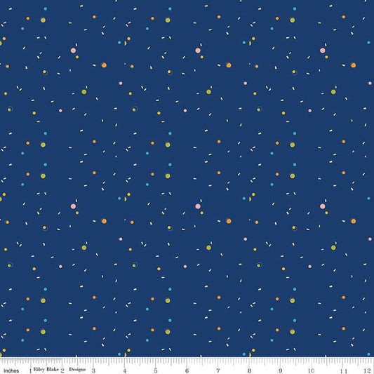 Image of the Pop 'n Play Confetti Navy quilting cotton fabric by Fisher-Price for Riley Blake Designs. Features spots on a blue background. Cute Little Fabric Shop