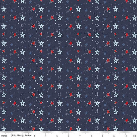 Image of the Stars and Stripes Forever Shooting Stars Navy quilting cotton fabric by Lori Whitlock for Riley Blake Designs. Features stars on a blue background. Cute Little Fabric Shop