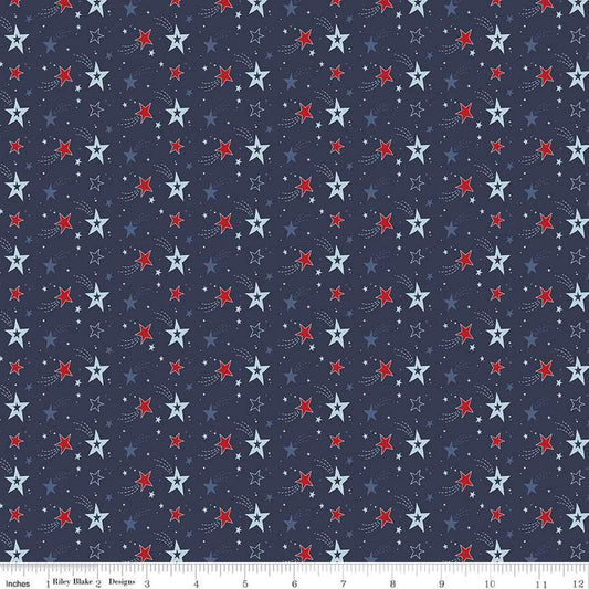 Image of the Stars and Stripes Forever Shooting Stars Navy quilting cotton fabric by Lori Whitlock for Riley Blake Designs. Features stars on a blue background. Cute Little Fabric Shop