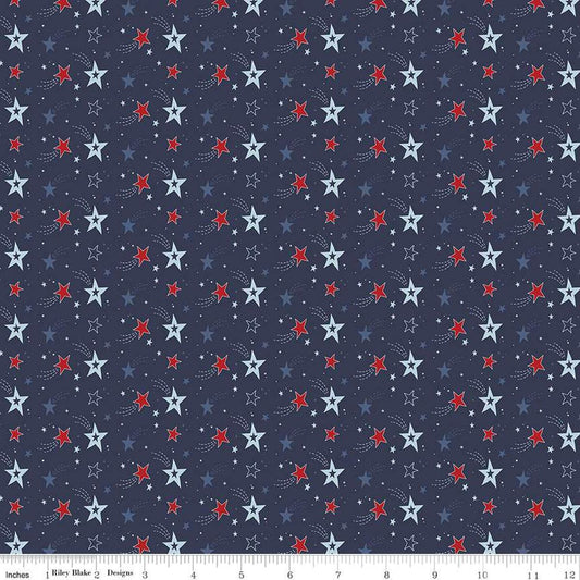 Image of the Stars and Stripes Forever Shooting Stars Navy quilting cotton fabric by Lori Whitlock for Riley Blake Designs. Features stars on a blue background. Cute Little Fabric Shop