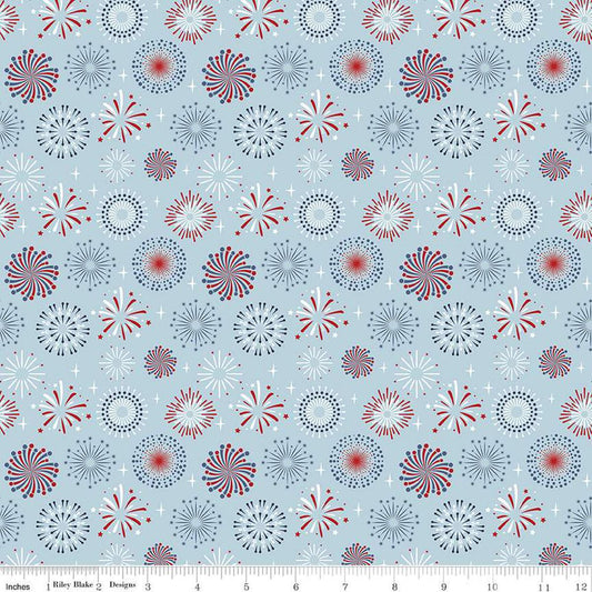 Image of the Stars and Stripes Forever Fireworks Sky quilting cotton fabric by Lori Whitlock for Riley Blake Designs. Features fireworks on a blue background. Cute Little Fabric Shop