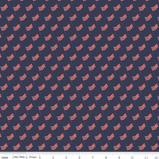 Image of the Stars and Stripes Forever Flags Navy quilting cotton fabric by Lori Whitlock for Riley Blake Designs. Features flags on a blue background. Cute Little Fabric Shop