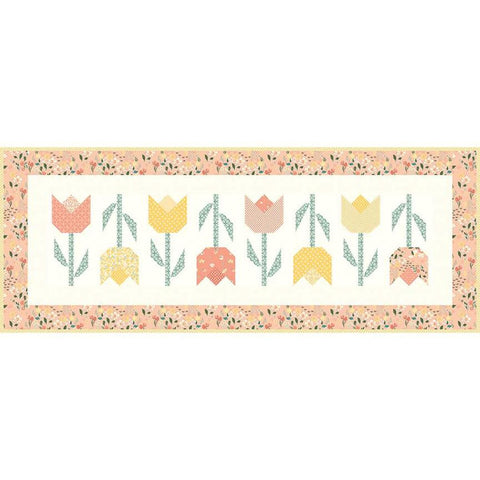 Image of the Tulip Festival Runner Boxed Kit by Sandy Gervais for Riley Blake Designs. Features flowers on a runner quilt. 
Cute Little Fabric Shop