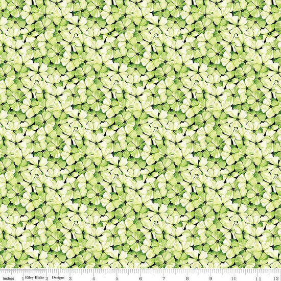 Image of the Sewing Seeds III Phlox Petals Green quilting cotton fabric by Lori Holt for Riley Blake Designs. Features flowers on a green background. Cute Little Fabric Shop