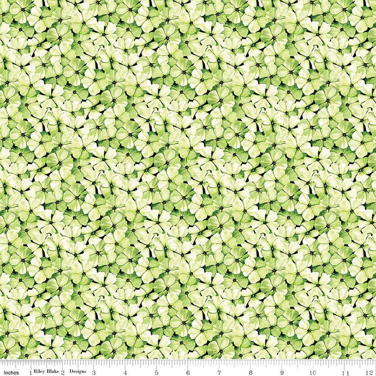 Image of the Sewing Seeds III Phlox Petals Green quilting cotton fabric by Lori Holt for Riley Blake Designs. Features flowers on a green background. Cute Little Fabric Shop