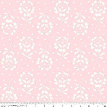 Image of the Sewing Seeds III Rose Cutwork Pink quilting cotton fabric by Lori Holt for Riley Blake Designs. Features flowers on a pink background. Cute Little Fabric Shop