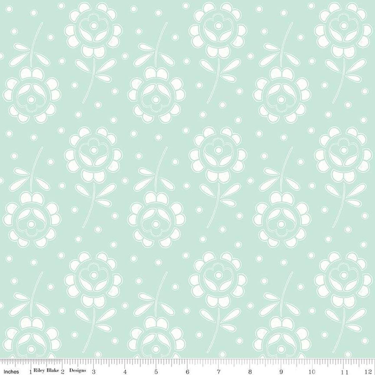 Image of the Sewing Seeds III Rose Cutwork Aqua quilting cotton fabric by Lori Holt for Riley Blake Designs. Features flowers on a pink background. Cute Little Fabric Shop