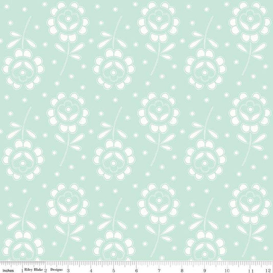 Image of the Sewing Seeds III Rose Cutwork Aqua quilting cotton fabric by Lori Holt for Riley Blake Designs. Features flowers on a pink background. Cute Little Fabric Shop