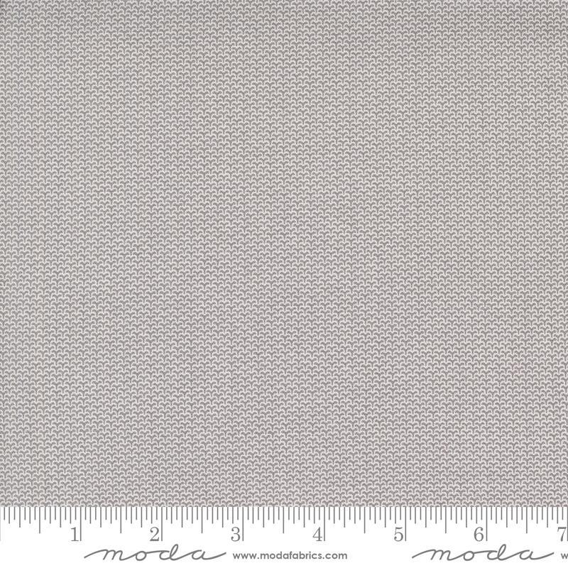 Image of the Itty Bitty Background Gatherings Diamond Gray quilting cotton fabric by Moda Fabrics. Features diamonds on a gray background. Cute Little Fabric Shop