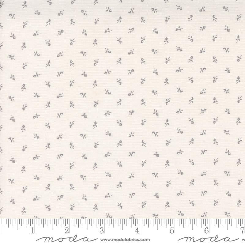 Image of the Itty Bitty Background Gatherings Tiny Grey quilting cotton fabric by Moda Fabrics. Features flowers on a gray background. Cute Little Fabric Shop