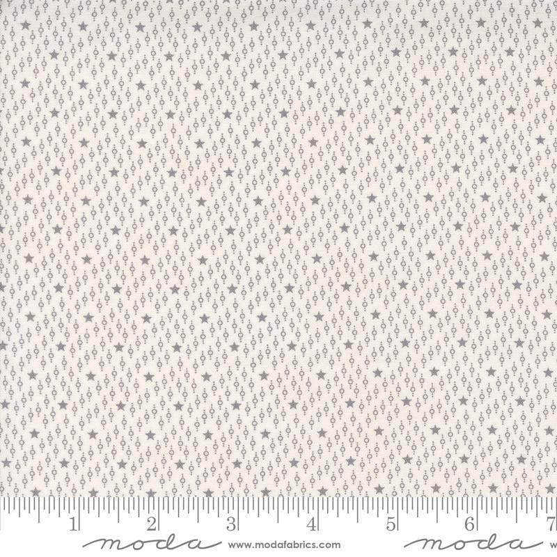 Image of the Itty Bitty Background Gatherings Starfield Grey quilting cotton fabric by Moda Fabrics. Features stars on a grey background. Cute Little Fabric Shop