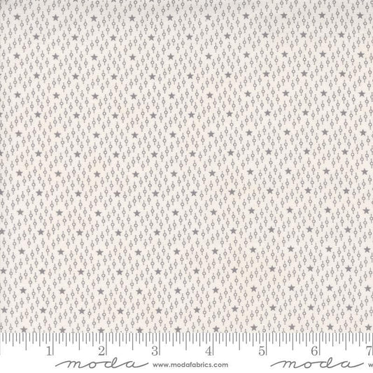 Image of the Itty Bitty Background Gatherings Starfield Grey quilting cotton fabric by Moda Fabrics. Features stars on a grey background. Cute Little Fabric Shop