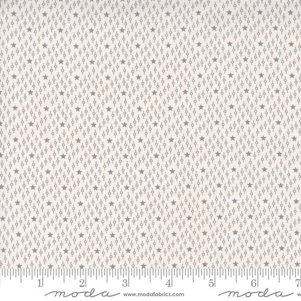 Image of the Itty Bitty Background Gatherings Starfield Grey quilting cotton fabric by Moda Fabrics. Features stars on a grey background. Cute Little Fabric Shop