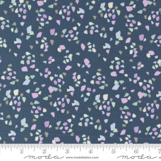 Image of the Seaglass Summer Pebble Indigo Sea quilting cotton fabric by Moda Fabrics. Features shapes on a navy blue background. Cute Little Fabric Shop