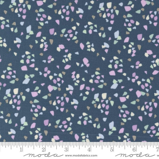 Image of the Seaglass Summer Pebble Indigo Sea quilting cotton fabric by Moda Fabrics. Features shapes on a navy blue background. Cute Little Fabric Shop