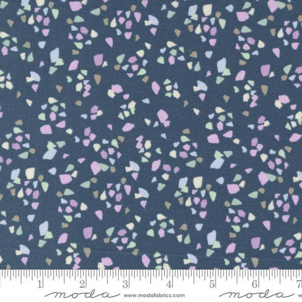 Image of the Seaglass Summer Pebble Indigo Sea quilting cotton fabric by Moda Fabrics. Features shapes on a navy blue background. Cute Little Fabric Shop